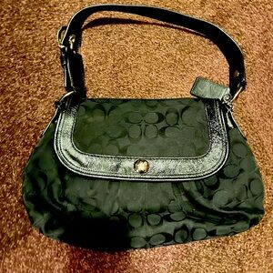 Black signature coach shoulder bag. Gently used.